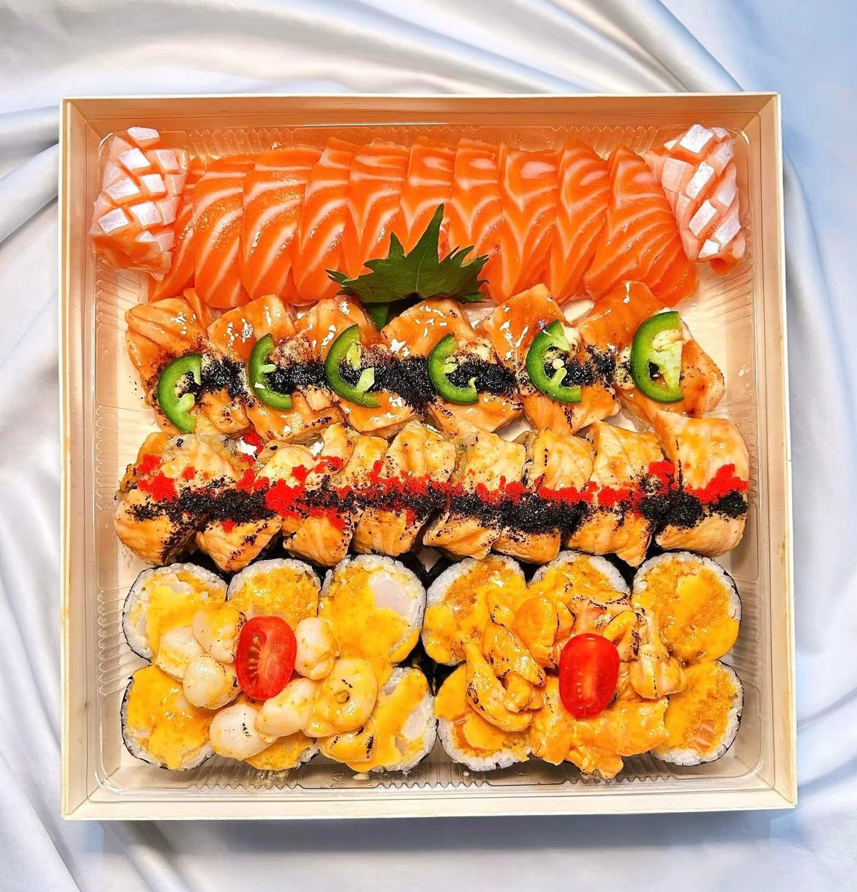 Ganfaner square wooden bento box filled with a salmon sashimi and sushi roll platter